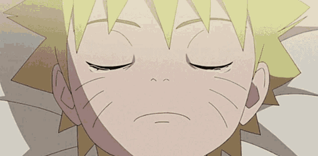 a close up of a child 's face with tears coming out of his eyes