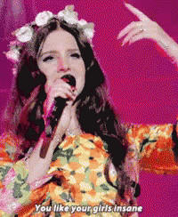 a woman singing into a microphone with the words " you like your girls insane " below her