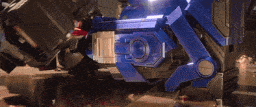 a close up of a blue and red robot 's arms and legs