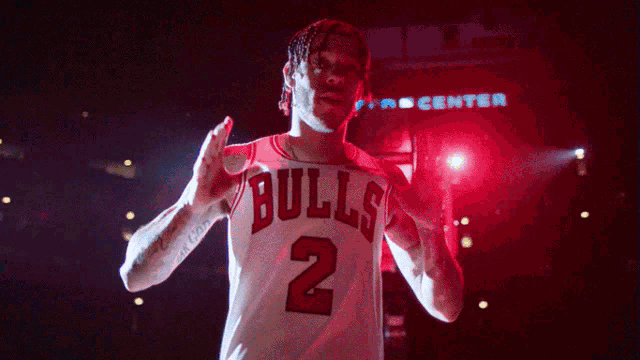 a man wearing a bulls jersey number 2