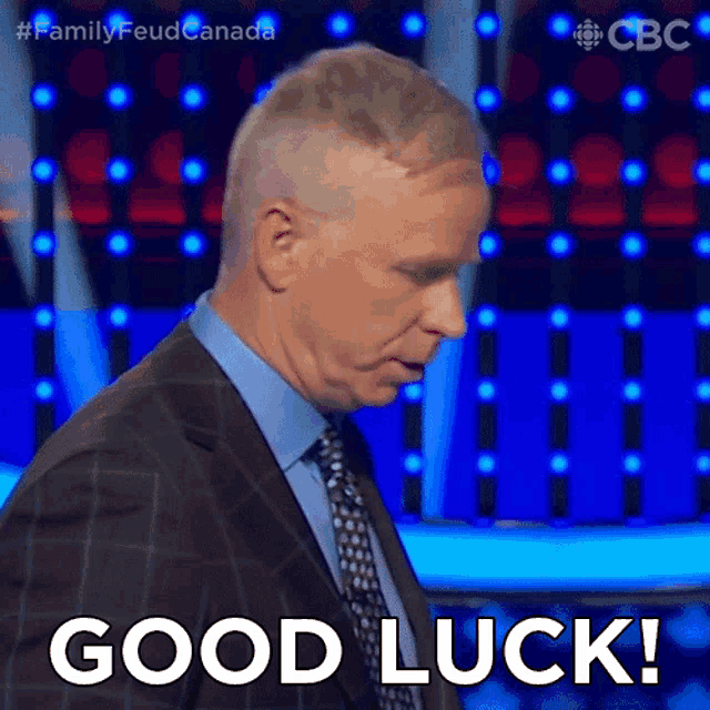 a man in a suit is saying good luck