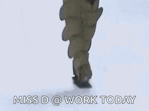 a woman is walking down a snow covered runway wearing a pair of ugg boots .