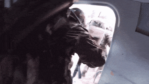 a group of soldiers are walking out of a plane