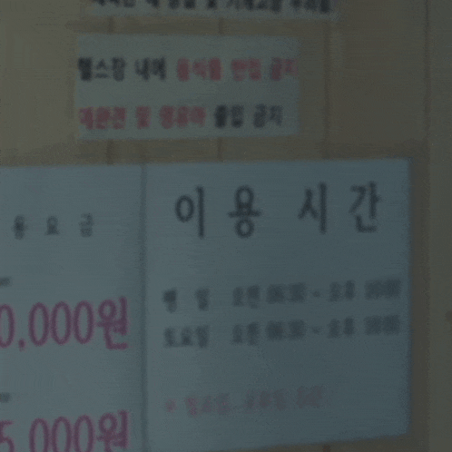 a woman stands in front of a sign that says 00
