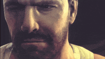 a close up of a man 's face with a beard in a video game
