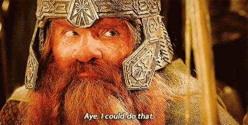 a man with a beard is wearing a helmet and saying aye i could do that .