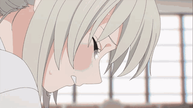a girl with white hair is crying with tears running down her face