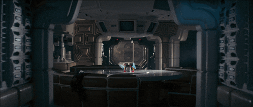 a futuristic room with a table and chairs and a door that says ' eee ' on it