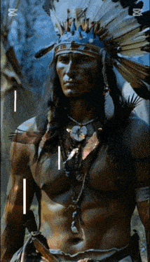 a man wearing a native american headdress and a necklace with the letter i on it
