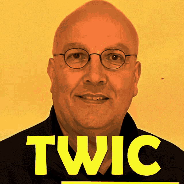 a bald man with glasses and the word twic on his face