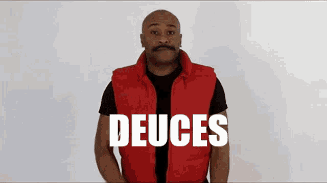 a man wearing a red vest with the word deuce written on it