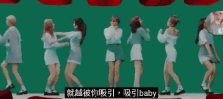 a group of women are dancing in front of a green screen and a sign that says ' baby '