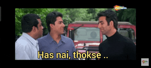 three men are standing next to each other and one of them is saying has nai thokse .