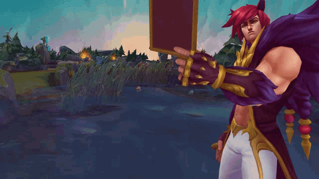 a man with red hair is holding a sign in front of a river