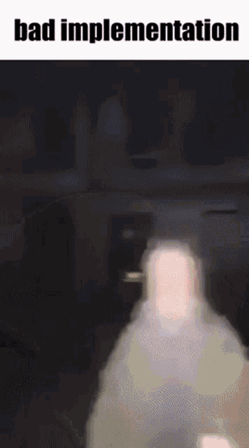 a blurry picture of a man with the words `` bad implementation '' written on the bottom .
