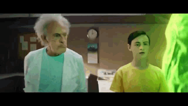 an older man in a lab coat stands next to a young boy in a yellow shirt ..