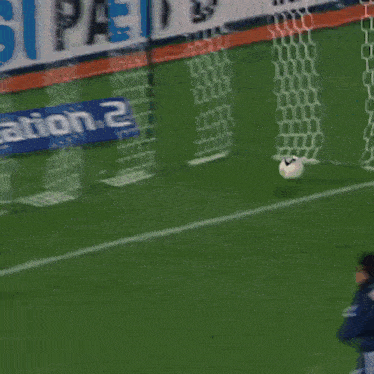 a soccer player with the number 21 on his back is running on the field