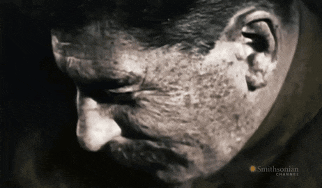 a close up of a man 's face with a smithsonian channel logo