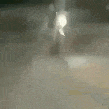 a blurred image of a person walking on a staircase