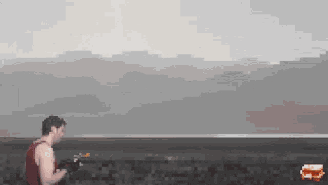 a pixel art of a man in a red tank top holding a remote control