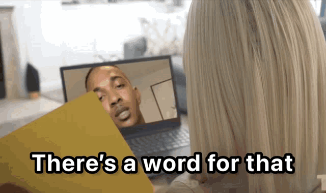 a woman sitting in front of a laptop with the words " there 's a word for that " on the bottom