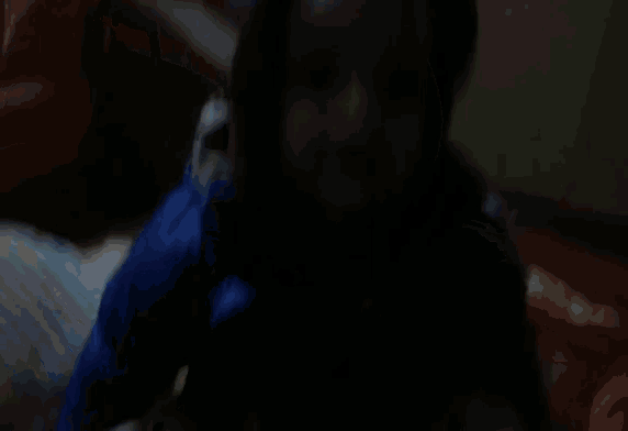 a person wearing a blue jacket with a hood