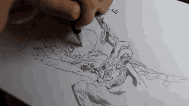 a person is drawing a rabbit with a pen