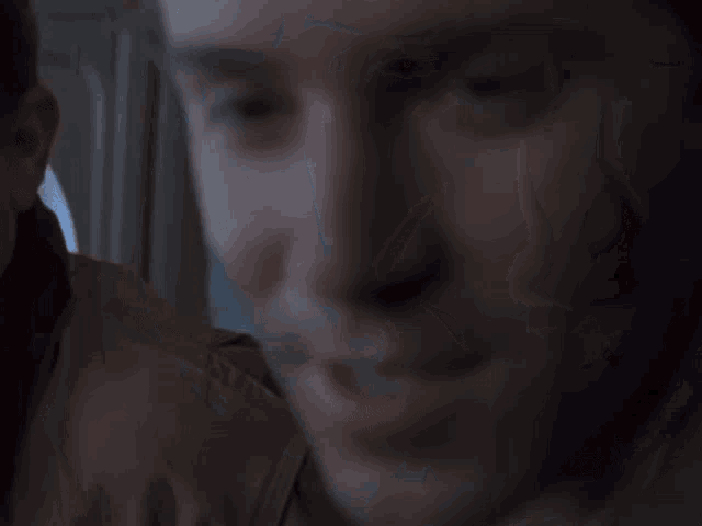 a close up of a man 's face smiling