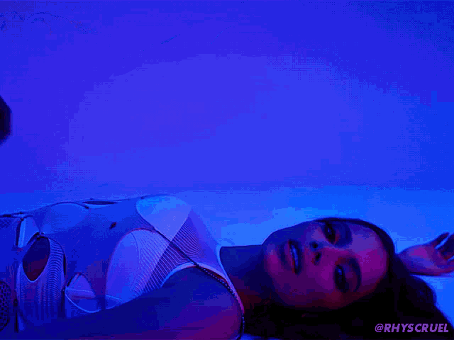 a man and a woman are laying on the floor with the hashtag rhys cruel