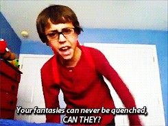 a boy in a red shirt and glasses says " your fantasies can never be quenched can they "