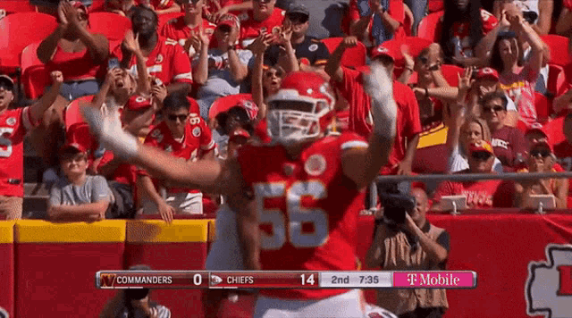 a football player in a red uniform with the number 56 on it