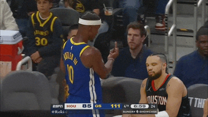a basketball player wearing a number 10 jersey giving the middle finger