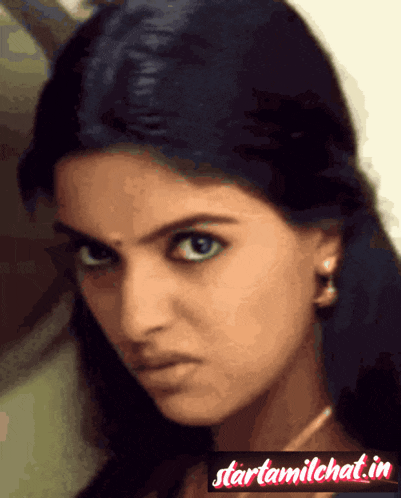 a close up of a woman 's face with the words starttamilchat.in in the upper right corner