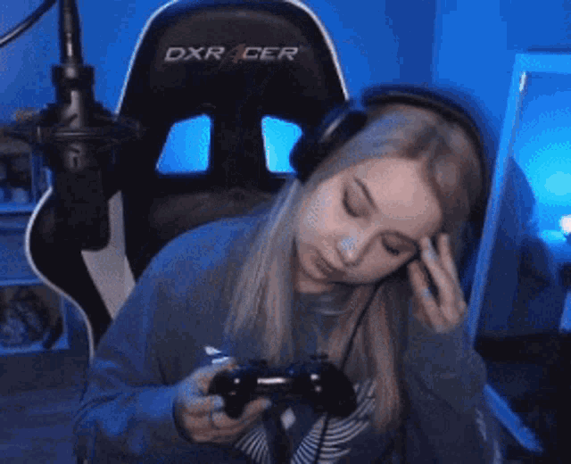 a girl is playing a video game and giving the middle finger .