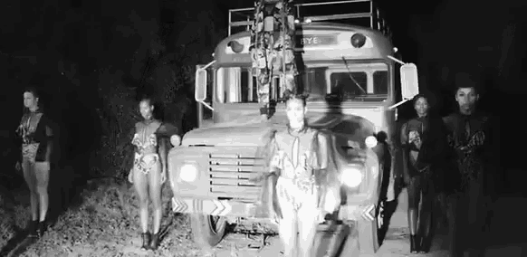 a group of people are standing in front of a bus that has the word rye on the side