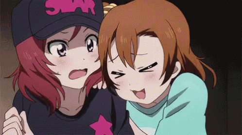 two anime girls one wearing a hat that says star on it