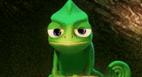 a green lizard with a pointed head and blue eyes