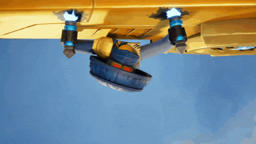 a cartoon character is hanging upside down from a yellow object