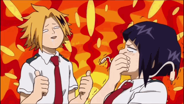 a boy and a girl are standing next to each other and the girl is covering her mouth with her hand