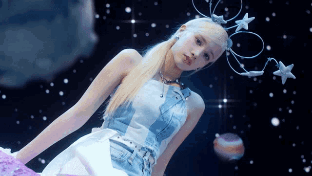 a woman with blonde hair wearing a headband with stars