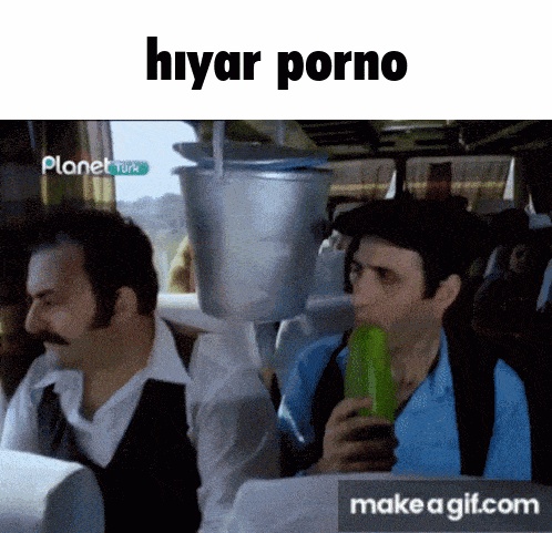 a man is eating a cucumber with a bucket on his head and the words hiyar porno above him