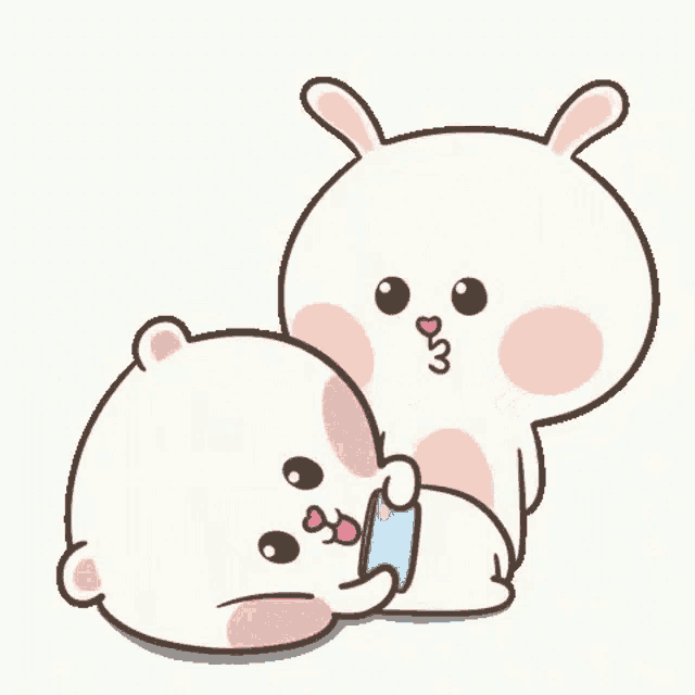 a couple of rabbits are sitting next to each other and hugging each other .