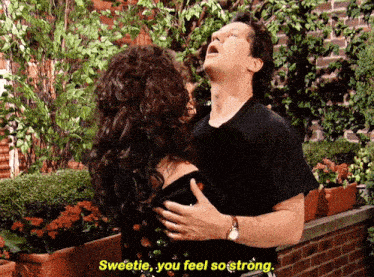 a man holds a woman in his arms with the words sweetie you feel so strong below him