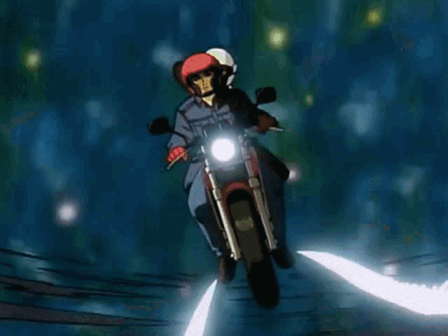 a man and woman are riding a motorcycle with wings