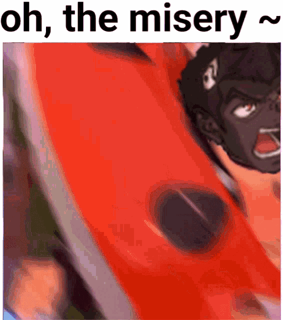 a close up of a red object with the words oh the misery written on it