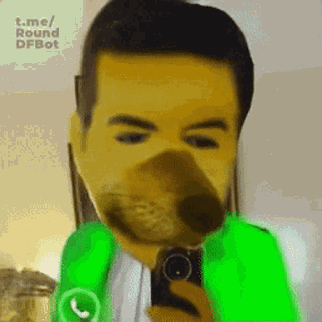 a man in a green jacket is taking a selfie with a dog face on his face
