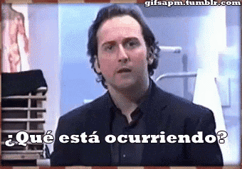 a man in a suit is asking " que esta occurriendo "