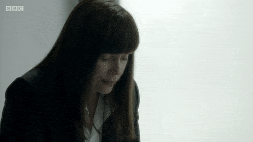 a woman with bbc written on the bottom of her screen