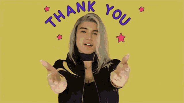 a woman with long blonde hair is giving a thank you gesture with her arms outstretched .