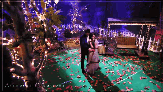 aiswarya creations shows a man and woman in a garden